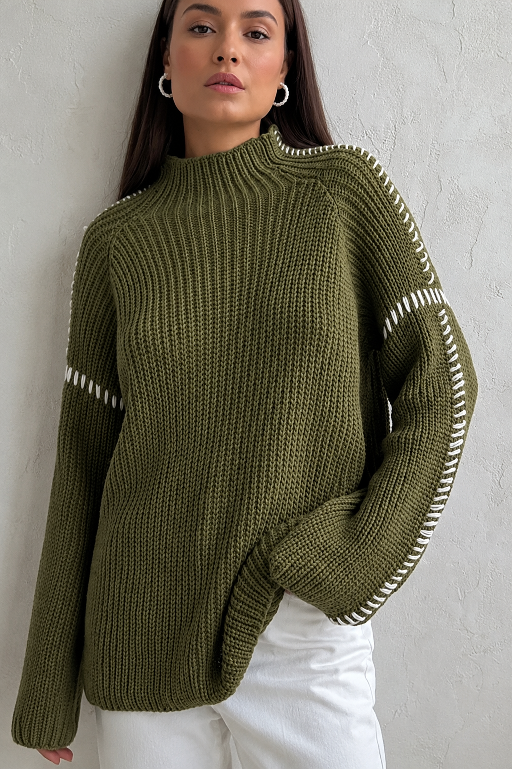 Cozy women's oversized knit jumper, long sleeve mock neck, featuring a chic contrast stitch design.