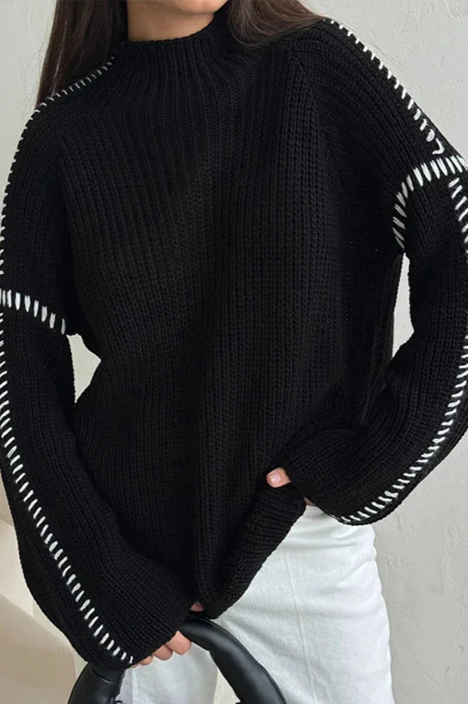 Relaxed fit women's oversized knit jumper, mock neck & long sleeves, highlighted by a unique contrast stitch.