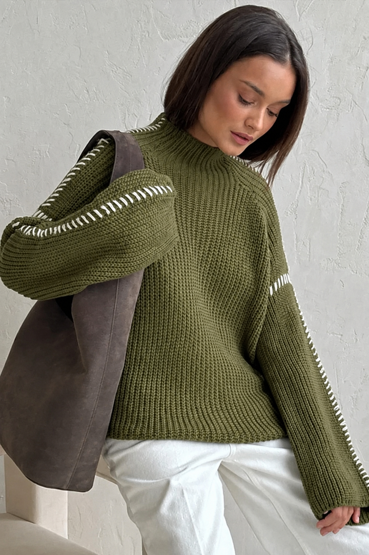 Women's chunky knit oversized mock neck jumper with stylish contrast stitch, perfect for winter fashion.