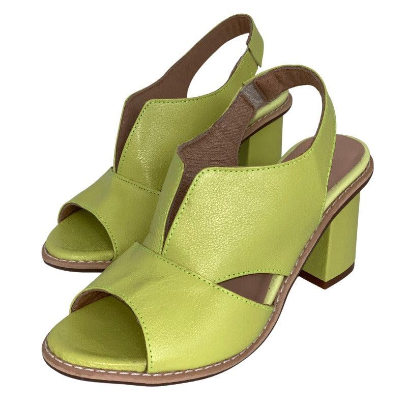 Model wearing women's elegant heeled sandals, demonstrating their classic style and comfortable fit.