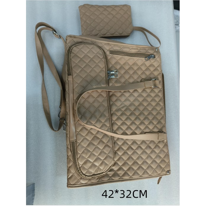 Woman carrying a modern quilted insulated lunch tote bag and matching wristlet, ideal for a professional look.