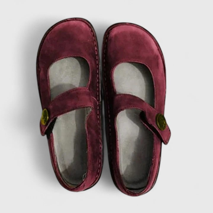 Comfortable women's Mary Jane flats. Features adjustable strap, cushioned footbed & round toe for all-day support.
