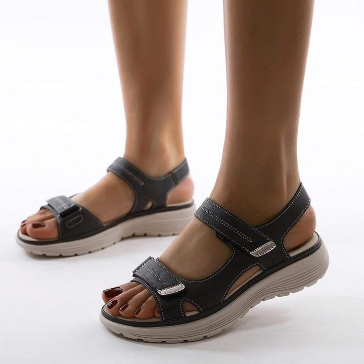 Durable women's travel sandals with orthopedic arch support & easy adjustable straps for summer.