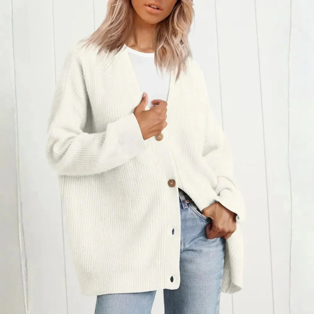 Soft ribbed knit longline cardigan for women, oversized fit with practical button front, versatile layering.