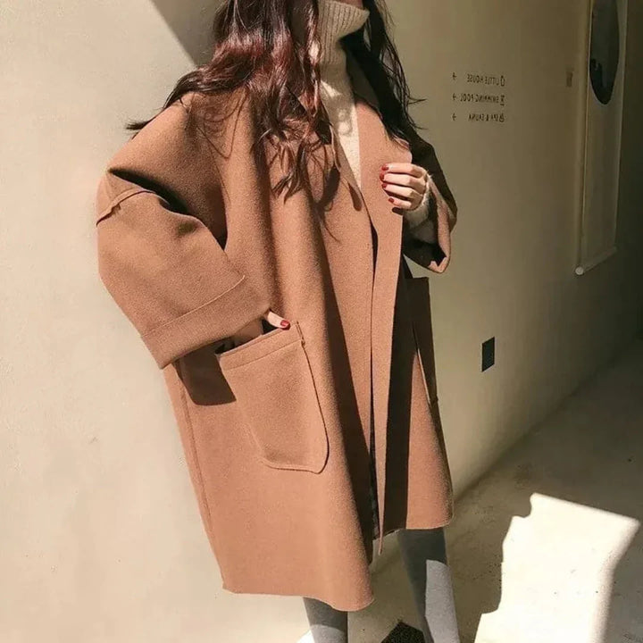 Sophisticated women's oversized lapel trench coat in a cozy coffee shade, ideal for winter layering.