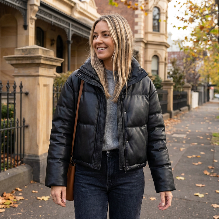 Fashionable women's cropped puffer jacket, a chic outerwear piece with a stand collar for winter style.