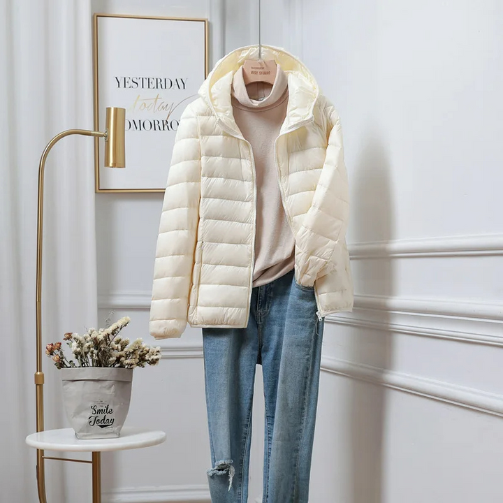 Stylish women's hooded puffer coat for fall & winter fashion. Warm quilted outerwear, perfect everyday wear.