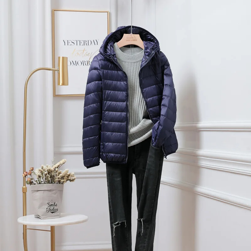 Womens hooded puffer jacket with warm insulation. Essential winter outerwear for cold weather & everyday comfort.