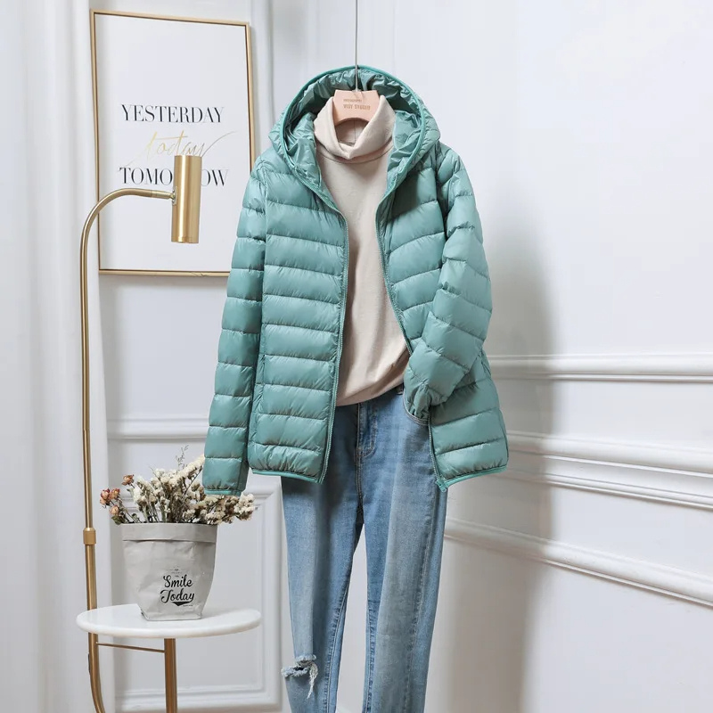 Warm women's hooded puffer coat, providing ultimate comfort & protection. Ideal winter outerwear for cold days.