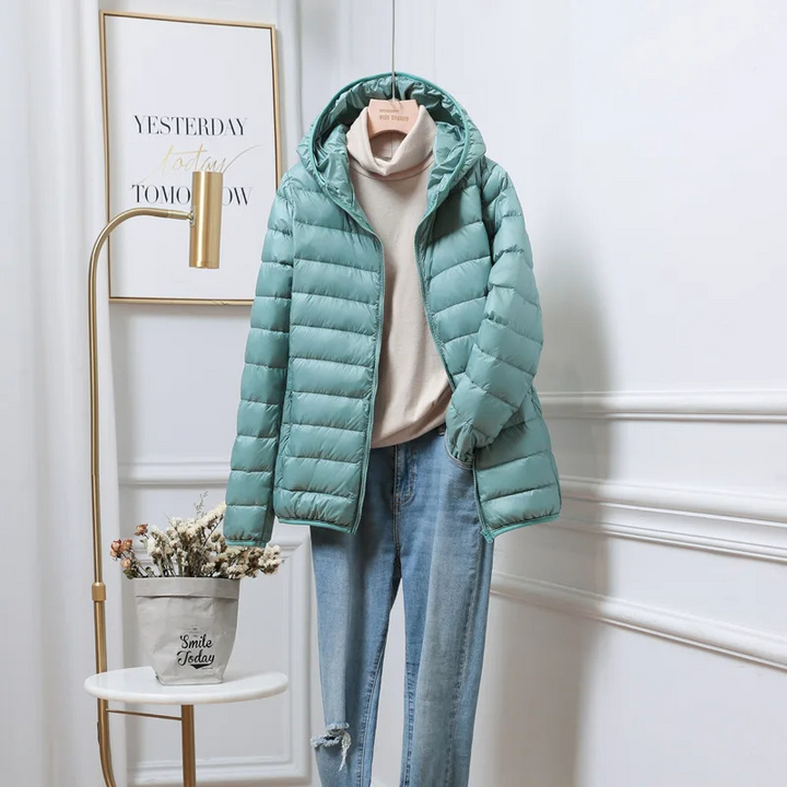 Warm women's hooded puffer coat, providing ultimate comfort & protection. Ideal winter outerwear for cold days.
