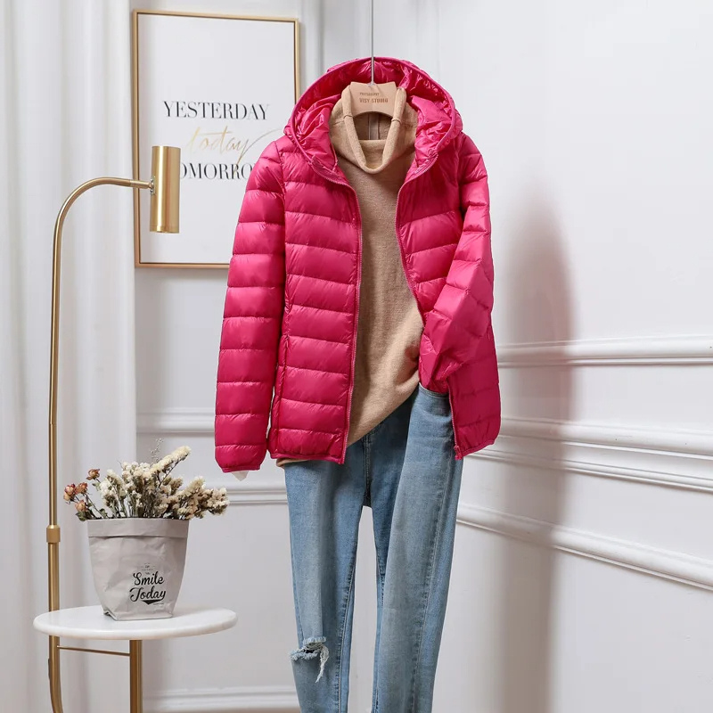 Practical women's hooded puffer jacket, perfect for warm winter outerwear. Casual quilted coat for cold weather.