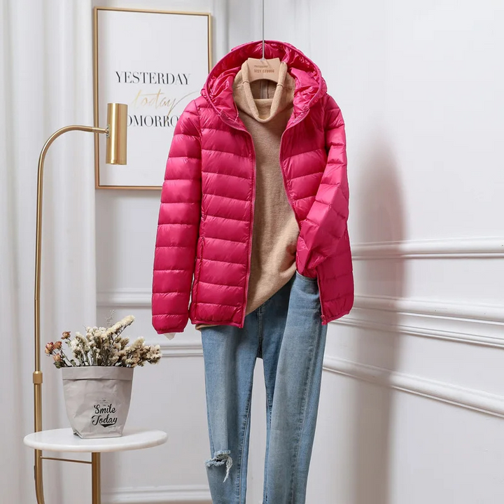 Practical women's hooded puffer jacket, perfect for warm winter outerwear. Casual quilted coat for cold weather.
