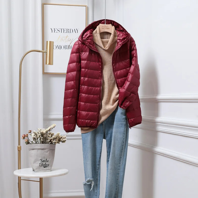 Versatile women's hooded puffer jacket for travel & everyday wear. Warm winter outerwear, quilted for cold weather.