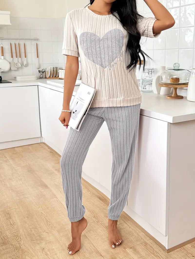 Stylish women's heart print pyjama set. Relaxed fit two-piece sleepwear, great for lounging and comfort.