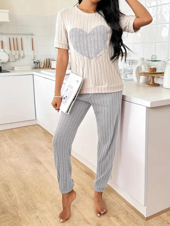 Stylish women's heart print pyjama set. Relaxed fit two-piece sleepwear, great for lounging and comfort.