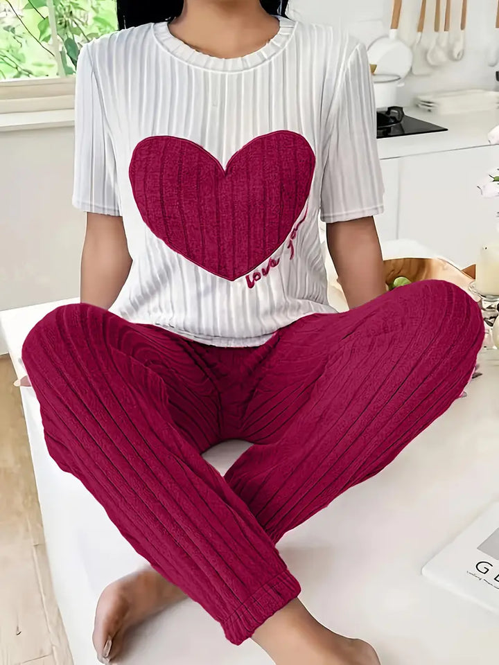 Ladies' two-piece heart print pyjama set. Cozy and soft loungewear for ultimate comfort and relaxation.
