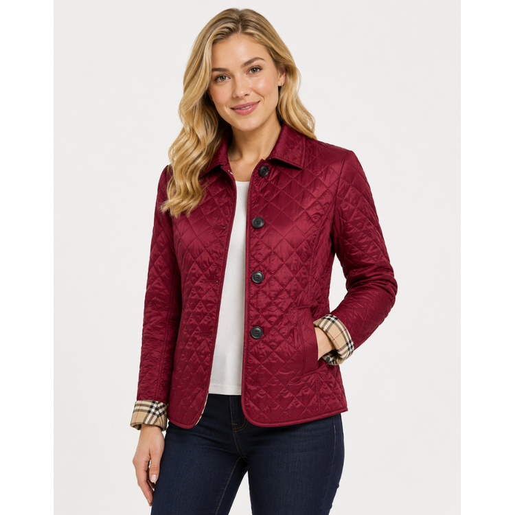 Women's diamond quilted jacket, perfect for transitional weather, with a cozy & chic plaid lining.