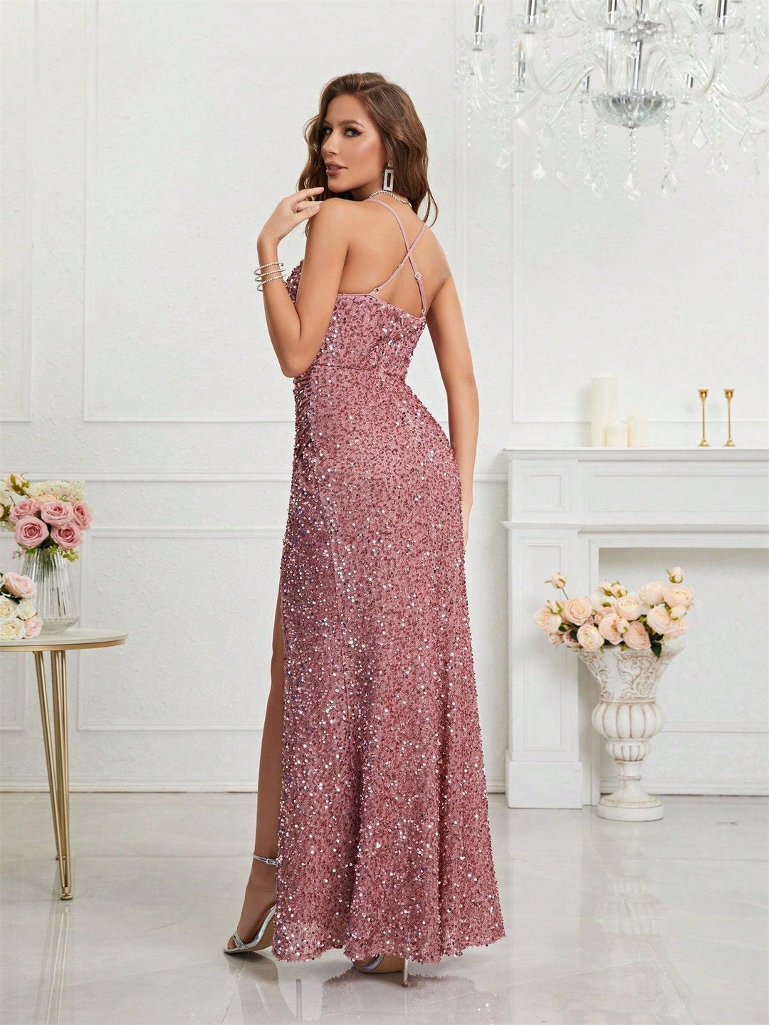 Shimmering women's sequin prom dress, sleeveless, featuring a daring plunge V-neck and an elegant high slit.