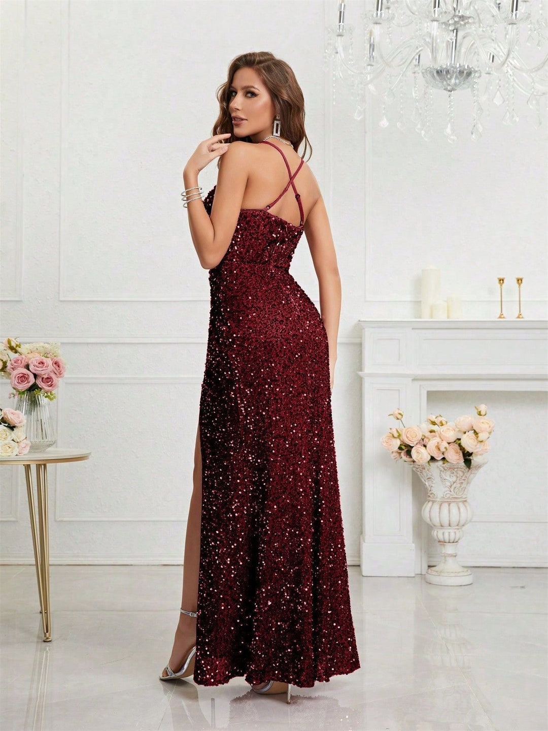 Modern women's sequin evening dress, sleeveless, with a contemporary plunge V-neck and a high leg slit.
