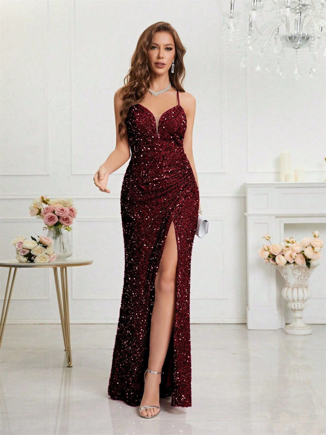 Women's luxurious sequin maxi dress with a plunge V-neck and a dramatic high slit. Ideal for evening.