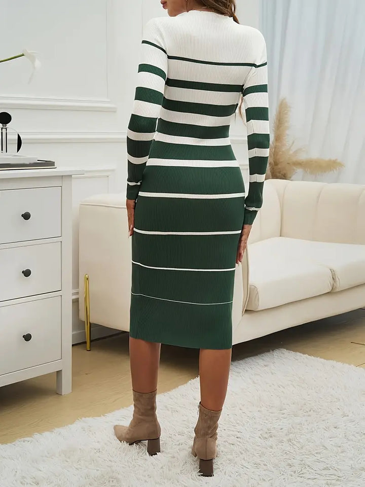 Woman in an elegant striped long sleeve midi knit dress, styled for a sophisticated winter women's fashion look.