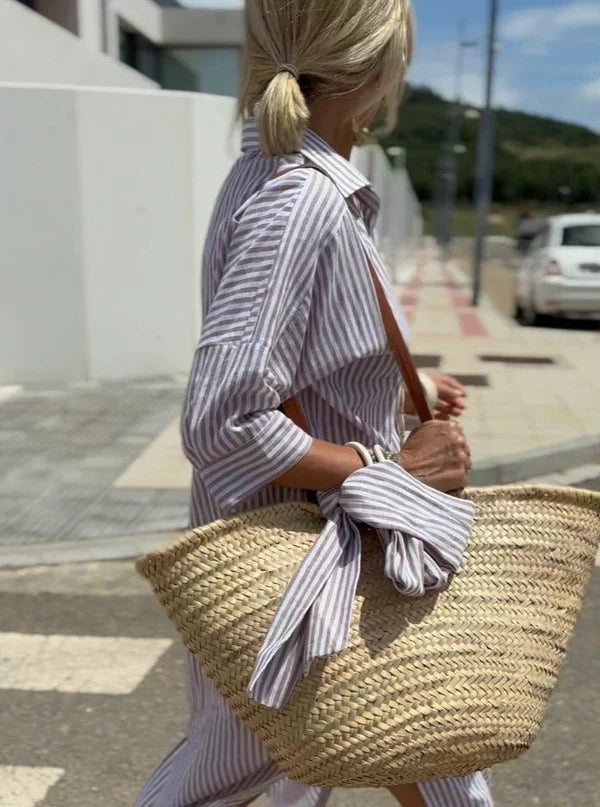 Stylish striped maxi dress for women, a comfortable summer shirt dress suitable for casual and vacation looks.