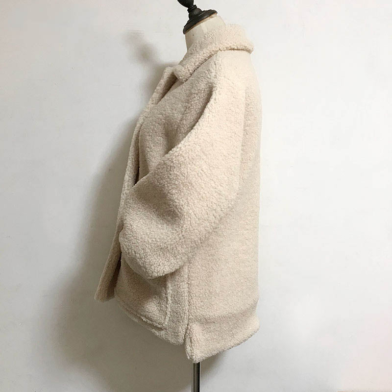 Fluffy women's teddy jacket offering ultimate cozy warmth & chic winter fashion.