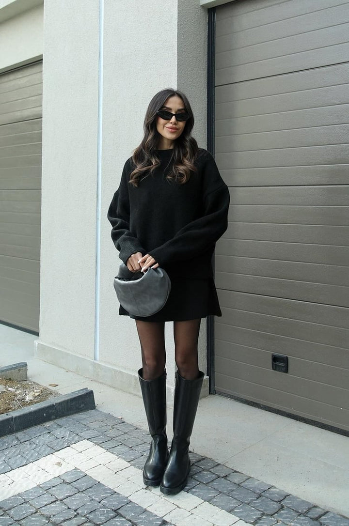 Trendy women's oversized sweater and mini skirt outfit. Stylish two-piece casual set.