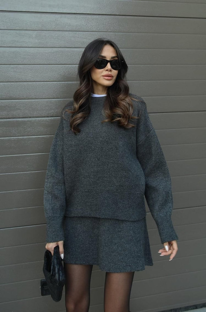 Women's trendy oversized sweater and mini skirt co-ord set. Effortlessly chic outfit.