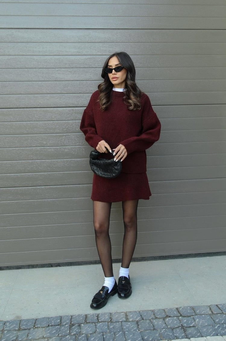 Stylish women's oversized sweater and mini skirt co-ord set for fall fashion.