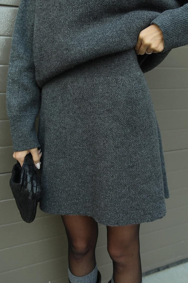Women's casual oversized sweater and mini skirt outfit. Comfortable and stylish two-piece.