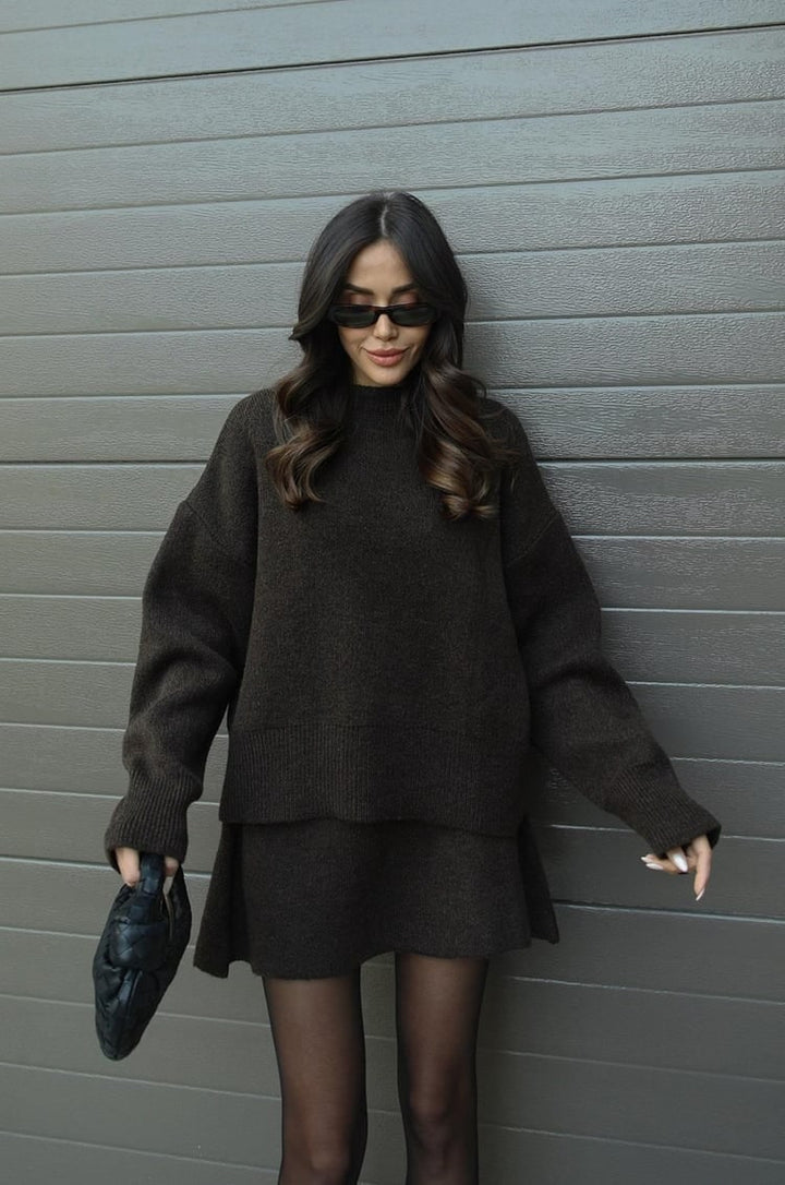 Elegant women's oversized sweater & mini skirt co-ord set. Perfect for a chic casual look.
