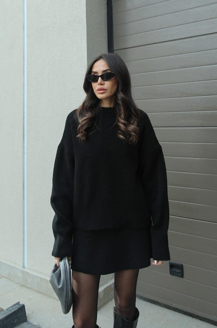 Warm women's oversized knit sweater and mini skirt set. Perfect cozy two-piece loungewear.