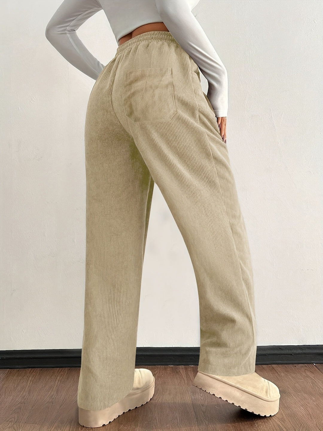 Stylish women's baggy wide leg corduroy pants, featuring a textured design and comfortable drawstring.