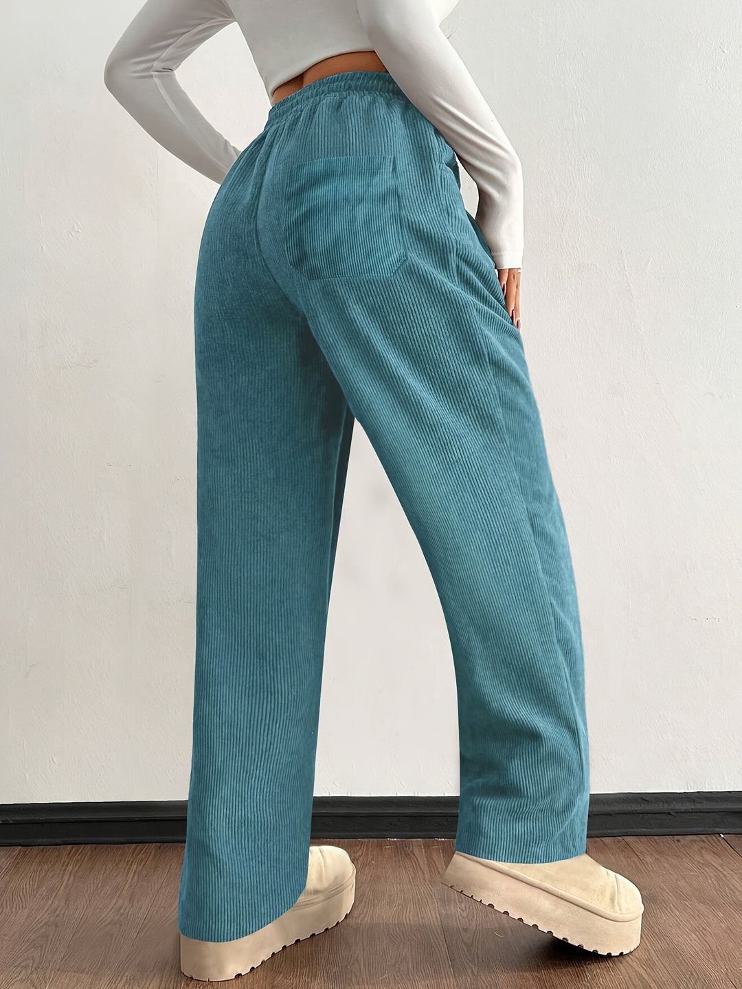 Fashionable women's wide leg textured corduroy pants, ideal for comfortable streetwear everyday wear.