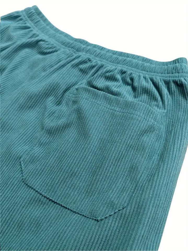 Baggy women's corduroy pants with a wide leg, textured finish, and practical pockets for comfort.