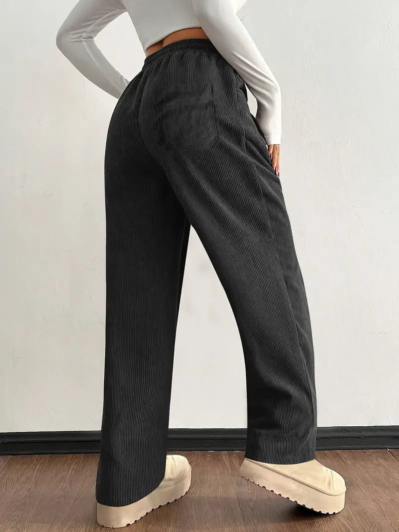 Women's wide leg baggy corduroy pants with a comfortable drawstring waist, ideal for everyday wear.