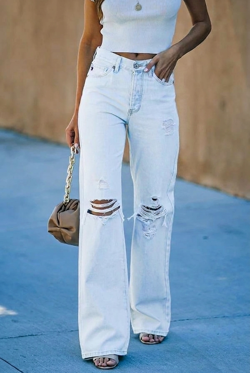 Women's high waist distressed wide leg jeans. Modern denim for casual wear, offering a comfortable and chic fit.