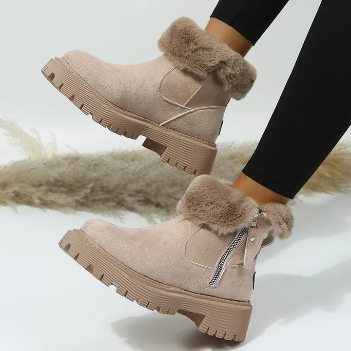 Cozy women's winter ankle boots, fleece-lined for warmth. Perfect cold weather footwear with a durable lug sole.