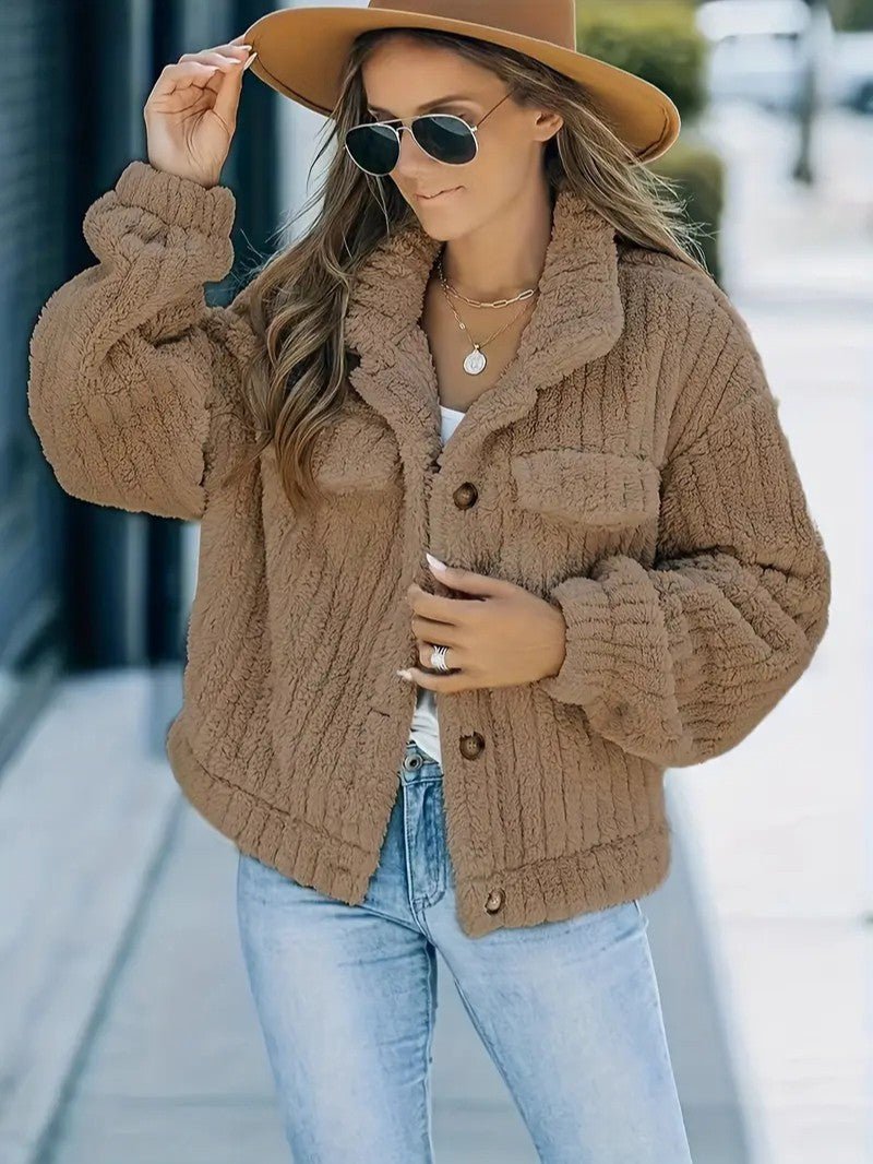 Chic women's collared winter jacket, featuring a classic button-up front, offering warmth and style for cold days.