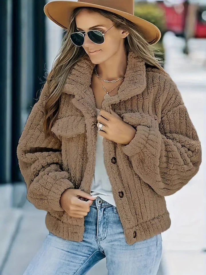 Fashionable women's cozy winter jacket, a button-up design with a warm collar, perfect for stylish fall & winter outfits.