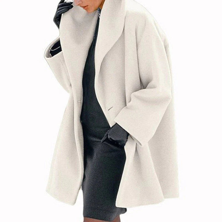 Women's elegant wool jacket for winter. Stay warm & stylish in this fashionable button-down outerwear.