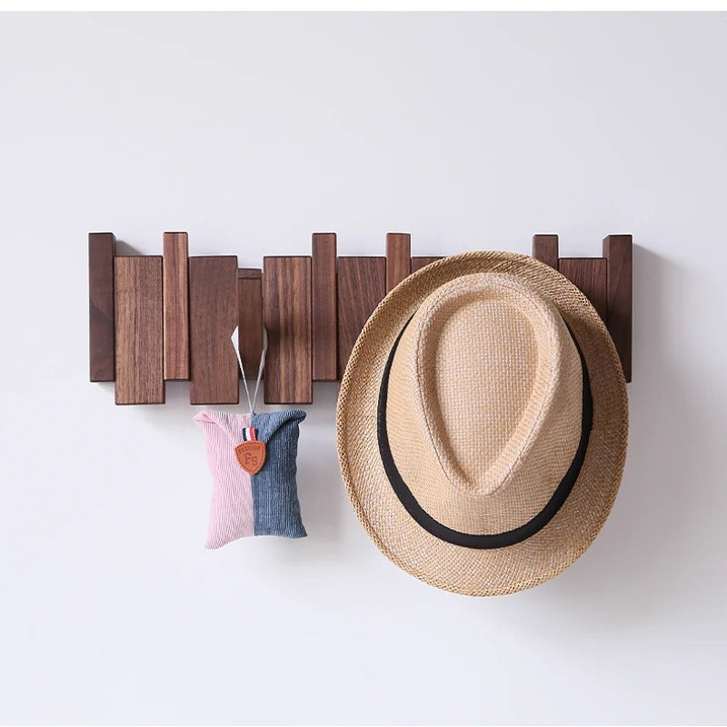 HarmonyCoat wooden piano wall rack. Modern foldable coat hooks for entryway organization and home decor.