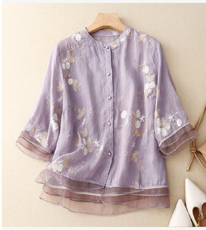 Light and airy women's sheer blouse with elegant floral embroidery and stylish layered look for summer.