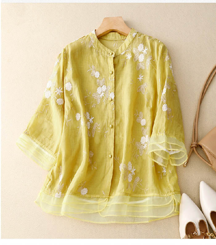 Beautiful floral embroidered sheer women's blouse, with an elegant layered design, perfect for spring fashion.