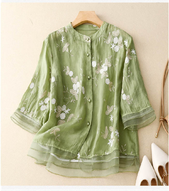 Elegant women's sheer floral embroidered blouse with layered design, perfect for spring/summer style.