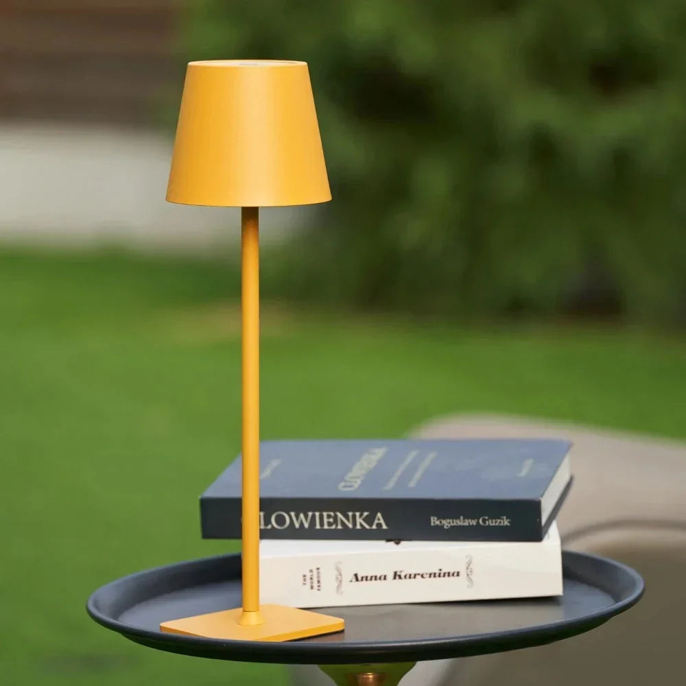 Rechargeable LED table lamp, modern and portable. Dimmable for indoor/outdoor ambiance.
