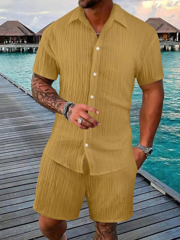 Two-piece men's summer outfit: short sleeve casual shirt & matching shorts for easy, breezy style.