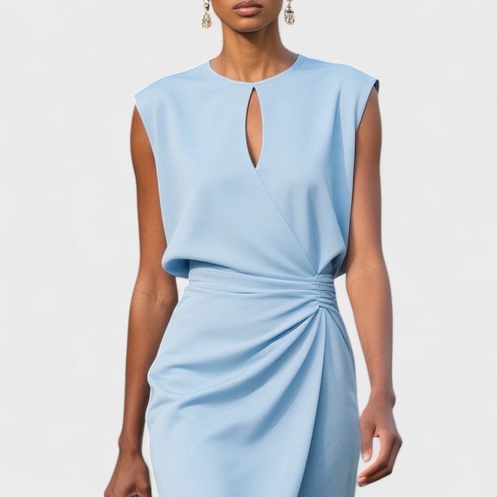 Close-up of elegant women's midi dress keyhole neckline & ruched wrap detail, ideal for spring/summer.