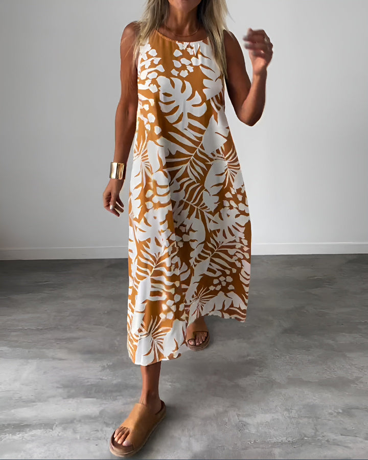 Women's tropical print sleeveless maxi dress, perfect for summer vacations & beachwear. Effortless style.